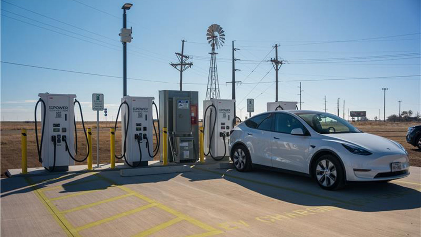 NEVI station with white Tesla charging