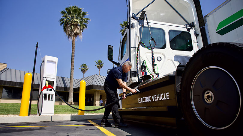 Driver charging their truck