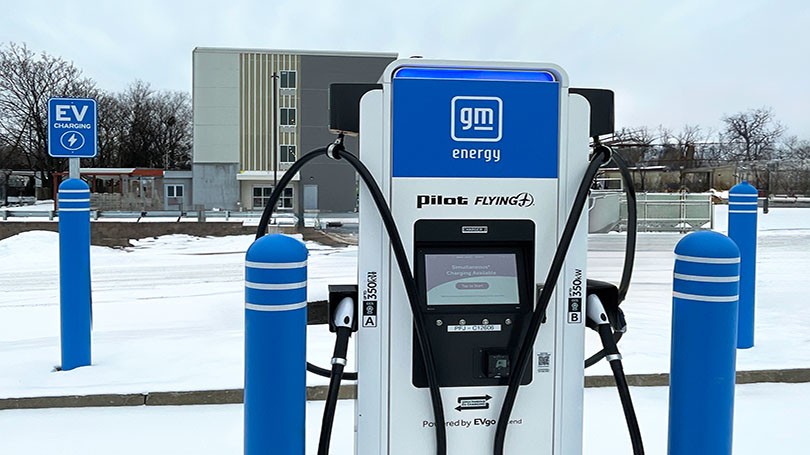 Chargers in snowy parking lot.