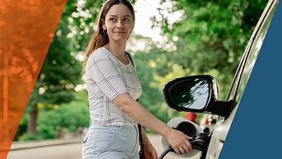 Woman charging car on side of rural road. 