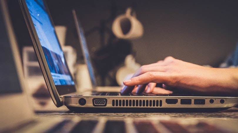 Hands typing on keyboard