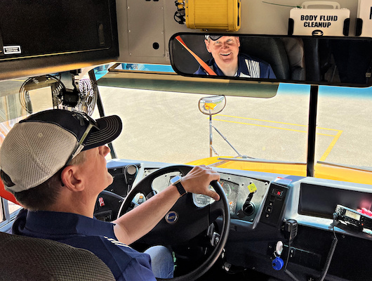 man driving electric school bus