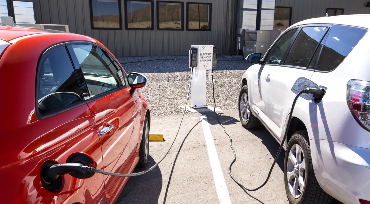 two electric vehicles charging