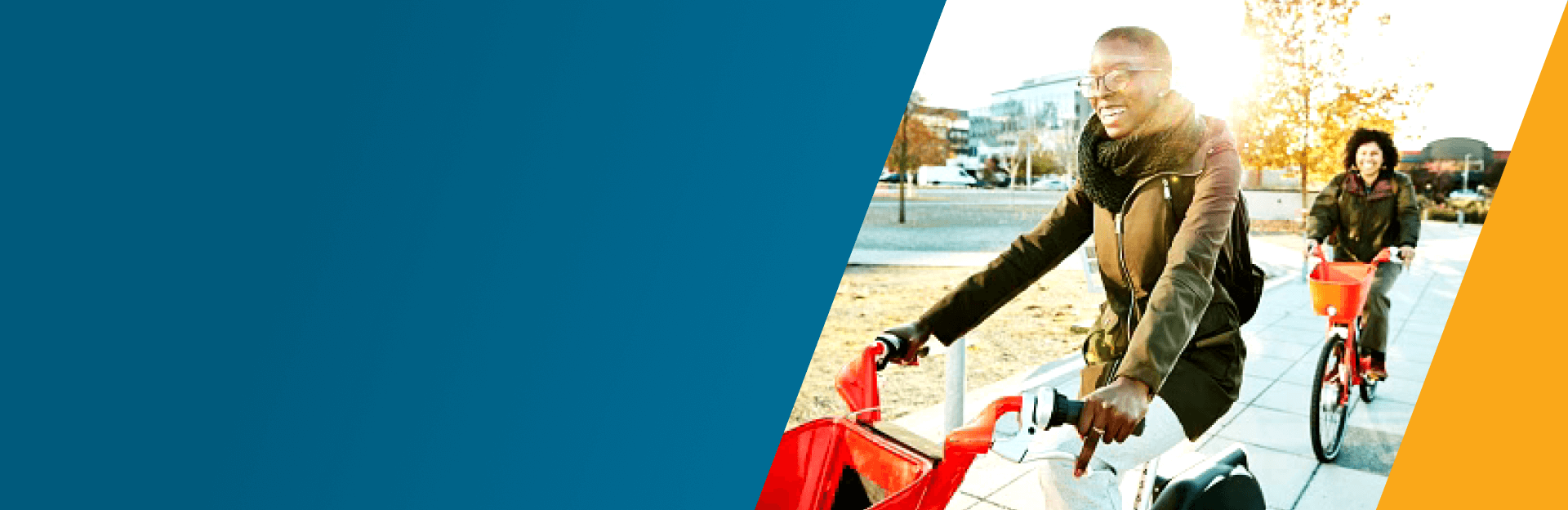 Two women riding electric bikes